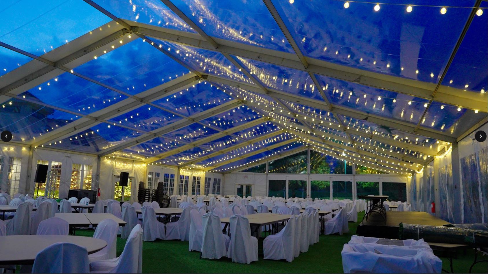 Clear-top structure tent wedding in Freeland, MI by Knights Tent & Party Rental