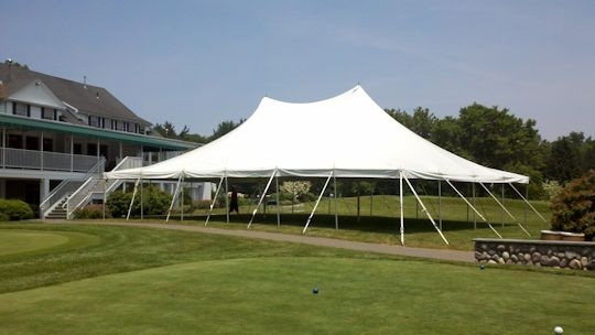 High-peak pole tent wedding in Northville, MI by Knights Tent & Party Rental
