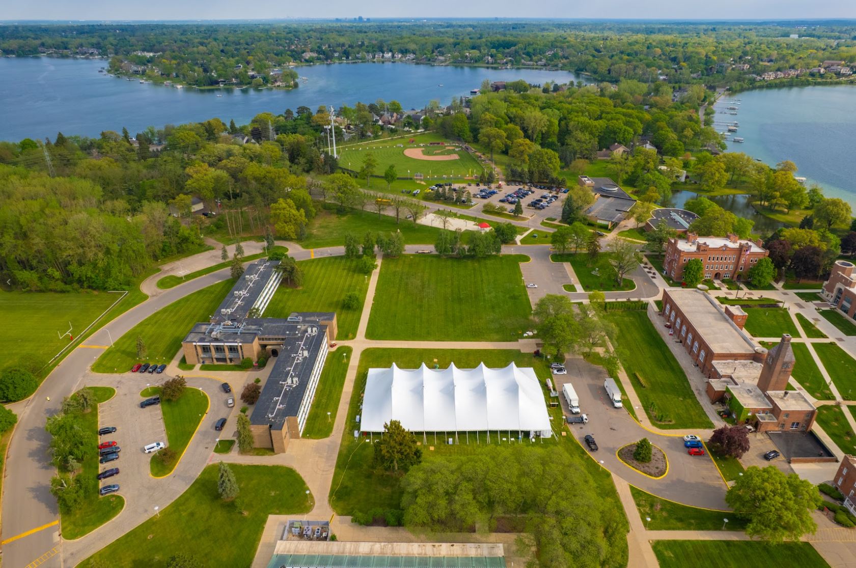 100 by 180 high-peak pole tent for the St. Mary's Prep commencement in Orchard Lake, MI by Knights Tent & Party Rental