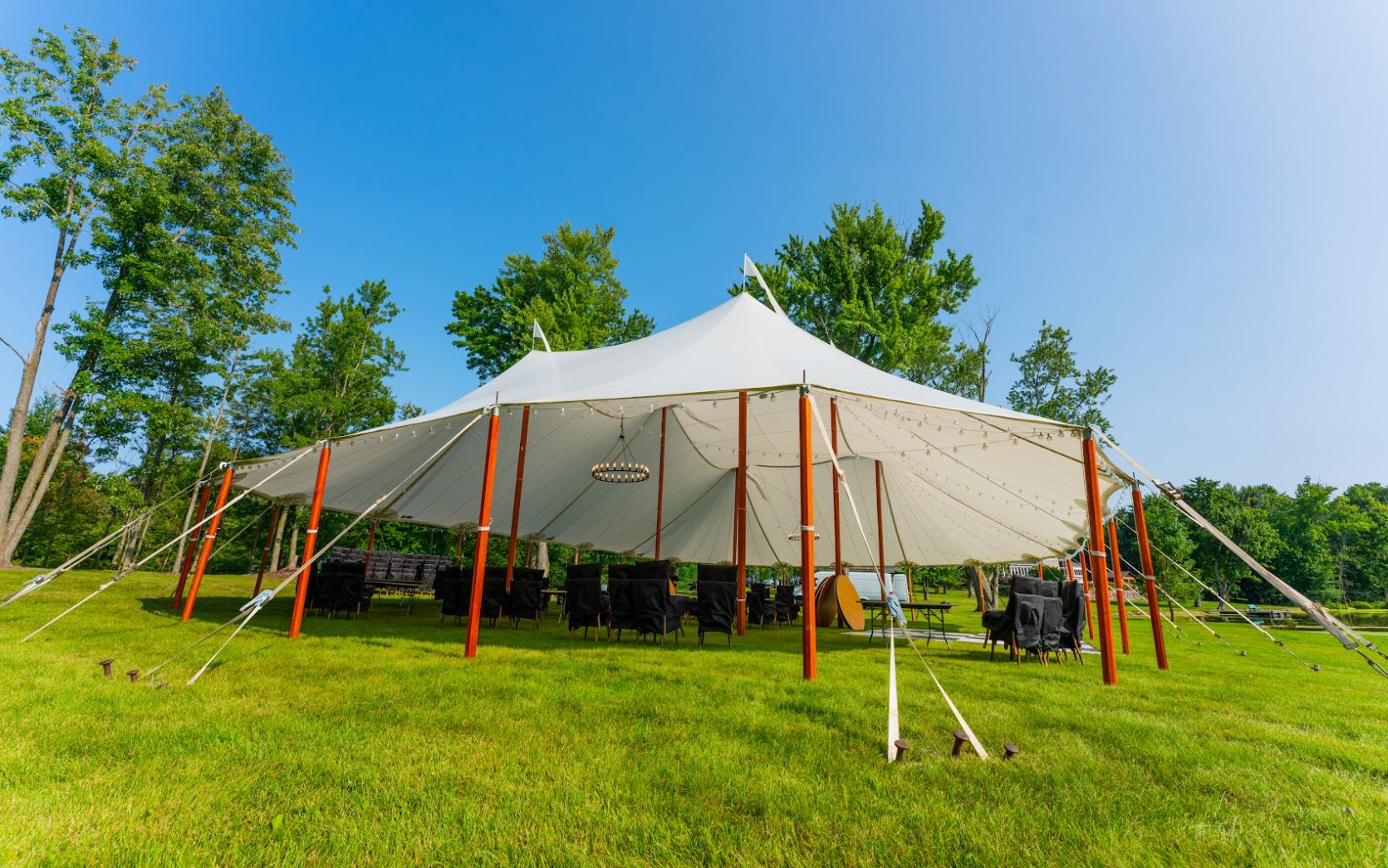 Sailcloth tent wedding in Oxford, MI by Knights Tent & Party Rental