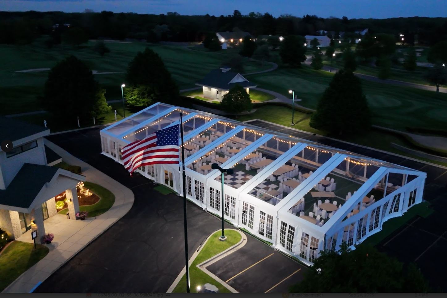 Clear-top structure tent evening wedding in Saginaw, MI by Knights Tent & Party Rental