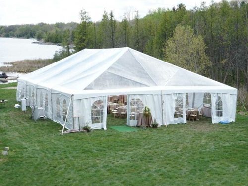 Lapeer Event 40x80 clear top frame tent in grass
