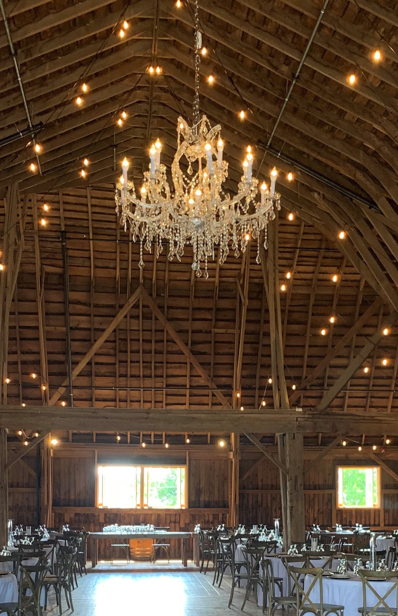 extravagant crystal chandelier in barn