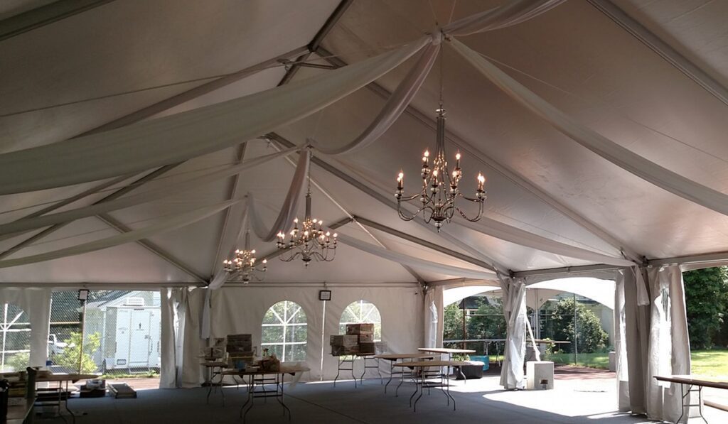 frame tent with swag drapery and chandeliers